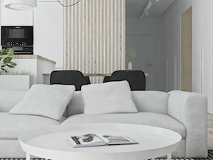 Mieszkanie w skandynawskim stylu - Mały szary salon z kuchnią z jadalnią - zdjęcie od Illa Design