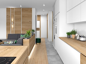 Drewno i zieleń - Średni szary salon z kuchnią z jadalnią z bibiloteczką, styl minimalistyczny - zdjęcie od Fabryka Nastroju Izabela Szewc
