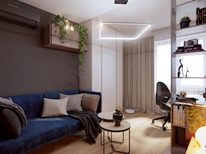 Gabinet z niebieską sofą - zdjęcie od Studio Projektowe Atoato