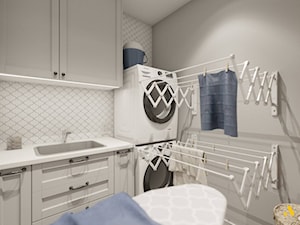 Jasnoszara pralnia ze składanymi suszarkami - zdjęcie od Studio Projektowe Atoato