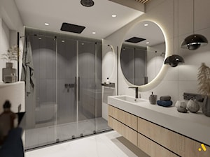 Łazienka z okrągłym podświetlanym lustrem - zdjęcie od Studio Projektowe Atoato