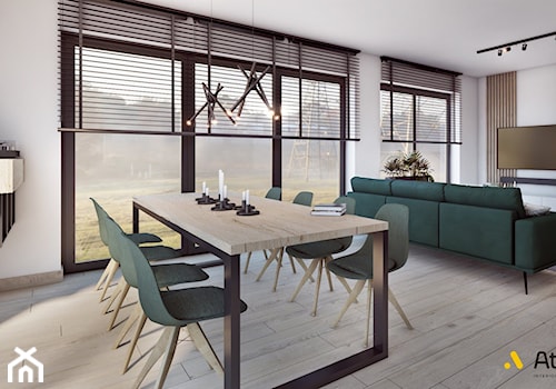salon z jadalnia i drewnianym stołem - zdjęcie od Studio Projektowe Atoato
