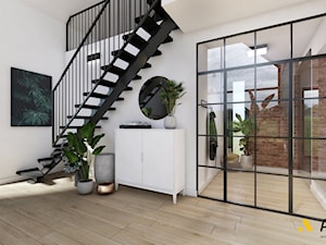 szklane drzwi pomiędzy salonem a korytarzem - zdjęcie od Studio Projektowe Atoato