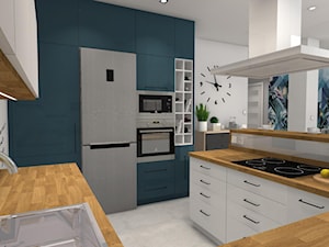 Kolor i nowoczesność w wyremontowanym domu. - Średnia otwarta szara z zabudowaną lodówką z nablatowym zlewozmywakiem kuchnia w kształcie litery g, styl nowoczesny - zdjęcie od Justyna Lewicka Design