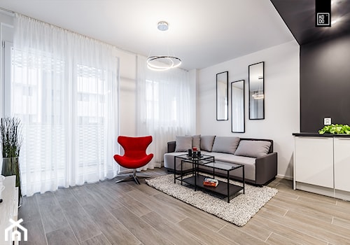 GEOMETRIA KONTROLOWANA - Średni biały czarny salon, styl minimalistyczny - zdjęcie od KODO projekty i realizacje wnętrz