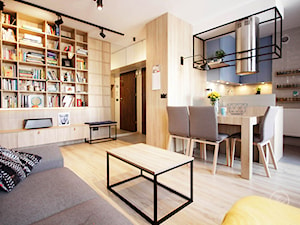 WOLA - Mały szary salon z kuchnią z jadalnią z bibiloteczką, styl industrialny - zdjęcie od Kołodziej & Szmyt Projektowanie Wnętrz