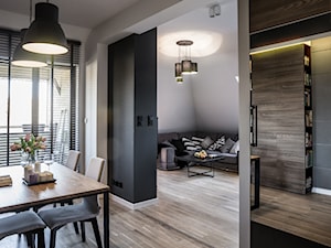 Gruntowny remont mieszkania na poddaszu - Średnia biała jadalnia jako osobne pomieszczenie, styl nowoczesny - zdjęcie od ESSA Architektura