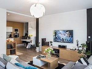 Mieszkanie 70mkw Wrocław - Średni biały salon z kuchnią z jadalnią z bibiloteczką, styl nowoczesny - zdjęcie od ESSA Architektura