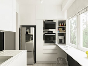 Metamorfoza kuchni Błonie - Średnia zamknięta biała z zabudowaną lodówką z podblatowym zlewozmywakiem kuchnia w kształcie litery u z oknem, styl glamour - zdjęcie od APkwadrat