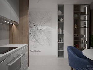 Mieszkanie w Warszawie - Średni biały salon z kuchnią z jadalnią z bibiloteczką, styl nowoczesny - zdjęcie od mgr sztuki arch. wnętrz Ewelina Matysiak
