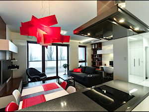 Apartament z nutką czerwieni - Średni szary salon z jadalnią z tarasem / balkonem z bibiloteczką, styl nowoczesny - zdjęcie od ARCHITETTO