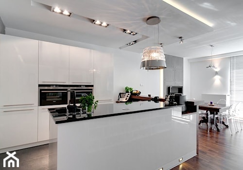 Kobiecy beton - Średni biały salon z kuchnią z jadalnią, styl minimalistyczny - zdjęcie od ARCHITETTO