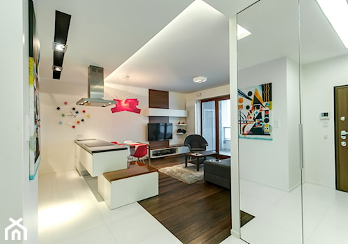 Apartament z nutką czerwieni - Średni biały salon z kuchnią z jadalnią, styl nowoczesny - zdjęcie od ARCHITETTO