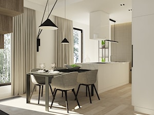 Apartament w Poznaniu - Średnia biała z podblatowym zlewozmywakiem kuchnia z wyspą lub półwyspem, styl nowoczesny - zdjęcie od Nasciturus design