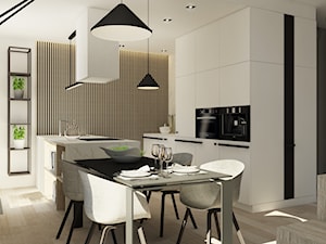 Apartament w Poznaniu - Średnia otwarta z salonem z kamiennym blatem biała z zabudowaną lodówką kuchnia dwurzędowa z marmurem nad blatem kuchennym, styl nowoczesny - zdjęcie od Nasciturus design