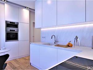 Mieszkanie inspirowane BAUHAUS'em - Średnia otwarta biała z zabudowaną lodówką z podblatowym zlewozmywakiem kuchnia w kształcie litery l z kompozytem na ścianie nad blatem kuchennym, styl minimalistyczny - zdjęcie od Atelier Słowiński