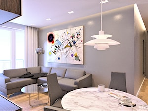 Mieszkanie inspirowane BAUHAUS'em - Mały szary salon z jadalnią z tarasem / balkonem, styl minimalistyczny - zdjęcie od Atelier Słowiński