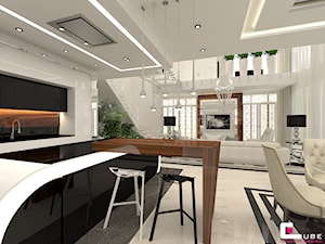 Dom pod Zambrowem - Średnia otwarta z salonem z kamiennym blatem biała z zabudowaną lodówką kuchnia w kształcie litery u z oknem, styl nowoczesny - zdjęcie od CUBE Interior Design