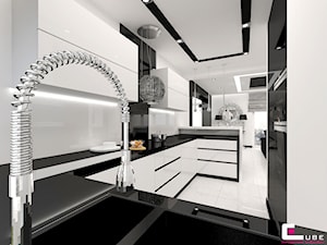 Dom w Elblągu - Średnia otwarta biała z zabudowaną lodówką z podblatowym zlewozmywakiem kuchnia w kształcie litery g, styl glamour - zdjęcie od CUBE Interior Design