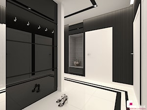 Mieszkanie w Rzeszowie - Duży z wieszakiem biały czarny hol / przedpokój, styl glamour - zdjęcie od CUBE Interior Design