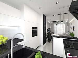 Mieszkanie 70 m2 w Warszawie - Średnia otwarta z salonem z kamiennym blatem biała z zabudowaną lodówką z podblatowym zlewozmywakiem kuchnia w kształcie litery g z oknem, styl nowoczesny - zdjęcie od CUBE Interior Design