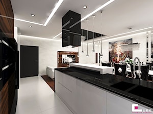 Mieszkanie w Warszawie - Duża z salonem biała z zabudowaną lodówką z podblatowym zlewozmywakiem kuchnia dwurzędowa z wyspą lub półwyspem, styl glamour - zdjęcie od CUBE Interior Design