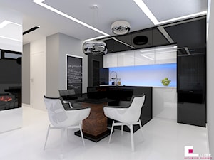Mieszkanie w Nowej Woli pod Warszawą - Średnia otwarta biała szara z zabudowaną lodówką kuchnia jednorzędowa z wyspą lub półwyspem, styl nowoczesny - zdjęcie od CUBE Interior Design