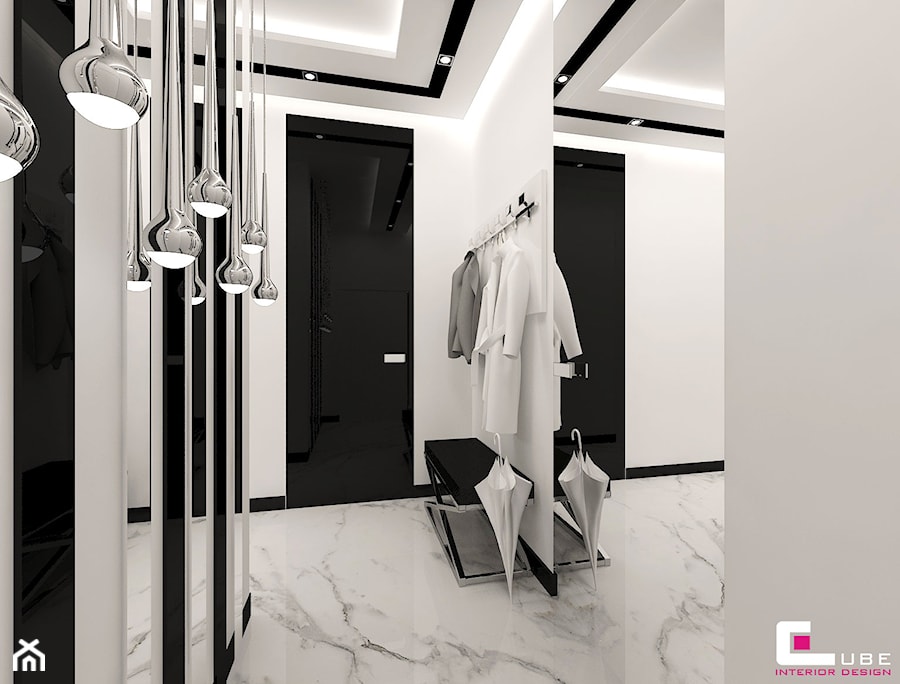 Mieszkanie pokazowe w Konstancinie-Jeziornie - Średni z wieszakiem biały czarny z marmurem na podłodze hol / przedpokój, styl glamour - zdjęcie od CUBE Interior Design