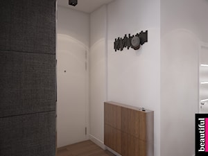 Apartament w sercu Warszawy - Średni z wieszakiem biały hol / przedpokój, styl nowoczesny - zdjęcie od Beautiful Minds Projektowanie Wnętrz