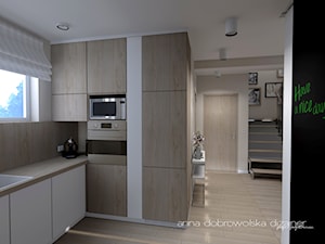 Wnętrze domu szeregowego - Otwarta z zabudowaną lodówką kuchnia z oknem, styl nowoczesny - zdjęcie od studio dizajner