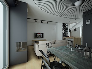 Projekt Wiklinowa Dolina, mieszkanie 90m2 - Średnia czarna szara jadalnia w salonie - zdjęcie od MArker Studio