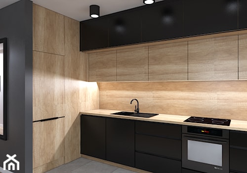 Mieszkanie z czarną kuchnią - Średnia otwarta czarna z zabudowaną lodówką z nablatowym zlewozmywakiem kuchnia w kształcie litery l, styl nowoczesny - zdjęcie od IM WNĘTRZA | Projektowanie wnętrz