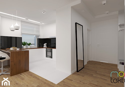 Mieszkanie 45m2 - Średnia otwarta biała czarna kuchnia w kształcie litery g z wyspą lub półwyspem, styl nowoczesny - zdjęcie od MONOTEKTURA