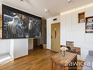 Mieszkanie na Bielanach - Duży biały salon z barkiem z bibiloteczką - zdjęcie od ZAWICKA-ID Projektowanie wnętrz