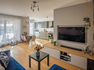 Mieszkanie Poznań - Realizacja - Duży szary salon z kuchnią z jadalnią, styl nowoczesny - zdjęcie od ememstudio