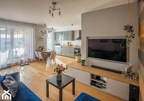 Mieszkanie Poznań - Realizacja - Duży szary salon z kuchnią z jadalnią, styl nowoczesny - zdjęcie od ememstudio