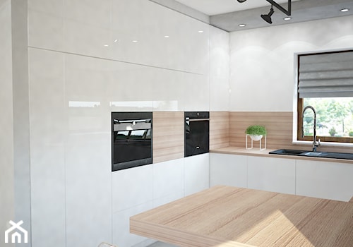 Projekt domu jednorodzinnego z pastelowymi kolorami - Średnia otwarta biała z zabudowaną lodówką z nablatowym zlewozmywakiem kuchnia w kształcie litery g z kompozytem na ścianie nad blatem kuchennym, styl nowoczesny - zdjęcie od Mart-Design Architektura Wnętrz
