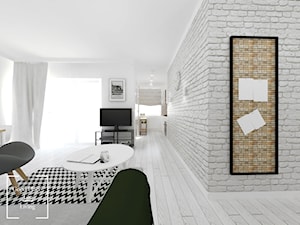 Mieszkanie w stylu skandynawskim osiedle Avia - Duży biały szary salon z kuchnią, styl skandynawski - zdjęcie od Good Place For Living
