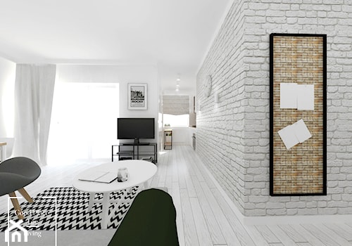 Mieszkanie w stylu skandynawskim osiedle Avia - Duży biały szary salon z kuchnią, styl skandynawski - zdjęcie od Good Place For Living