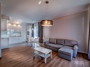 Nowoczesna aranżacja mieszkania pod wynajem - Średni biały pomarańczowy salon z kuchnią z jadalnią, styl nowoczesny - zdjęcie od MG Invest Park
