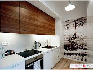 Mała z salonem biała z zabudowaną lodówką z podblatowym zlewozmywakiem kuchnia jednorzędowa, styl nowoczesny - zdjęcie od Borowczyk Architekci