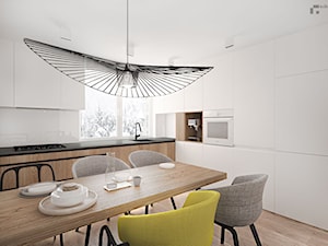 Mieszkanie J - projekt - Średnia otwarta biała z zabudowaną lodówką kuchnia w kształcie litery l, styl minimalistyczny - zdjęcie od Pracownia Kaffka