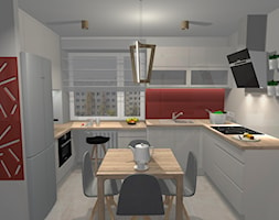 Kuchnia z elementami czerwieni i drewnem dębowym - zdjęcie od lightcenter.pl - Homebook