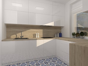 Kuchnia z niebiesko-białą mozaiką na podłodze - zdjęcie od DIZU Studio Projektowe