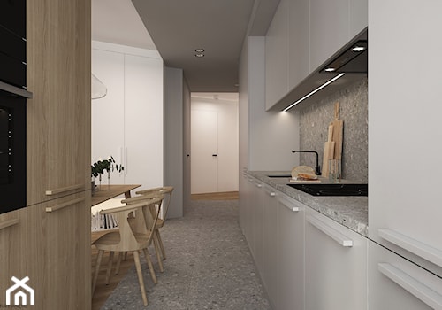 Mieszkanie w Krakowie - Średnia otwarta z kamiennym blatem biała szara z zabudowaną lodówką z podblatowym zlewozmywakiem kuchnia dwurzędowa z kompozytem na ścianie nad blatem kuchennym z marmurową podłogą, styl minimalistyczny - zdjęcie od ELEMENTY