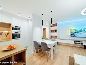 mieszkanie 60m2 ul. Melomanów Lublin - Średnia biała jadalnia w salonie w kuchni, styl nowoczesny - zdjęcie od Auraprojekt