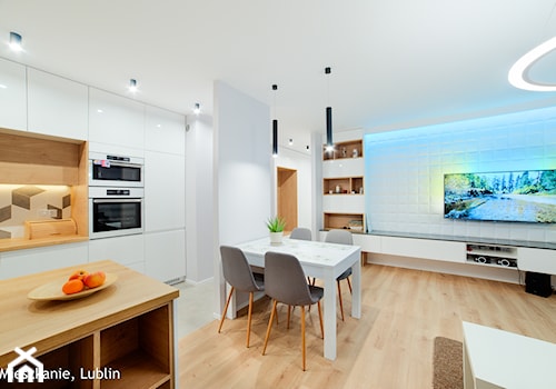 mieszkanie 60m2 ul. Melomanów Lublin - Średnia biała jadalnia w salonie w kuchni, styl nowoczesny - zdjęcie od Auraprojekt