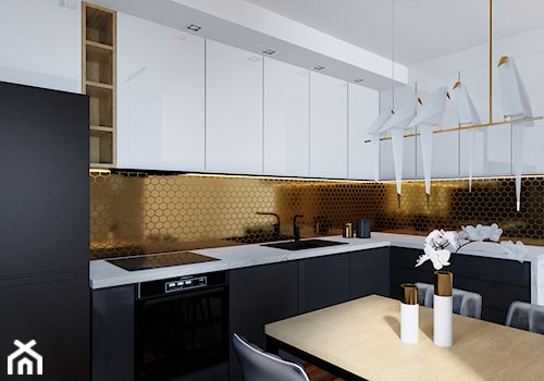Kuchnia czarno-biało-złota - Mała otwarta z zabudowaną lodówką z podblatowym zlewozmywakiem kuchnia w kształcie litery l, styl nowoczesny - zdjęcie od Przestrzenie