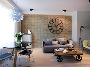 Konkurs - apartament post-industrialny - Mały szary salon z jadalnią, styl industrialny - zdjęcie od Chałupko Design