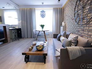 Konkurs - apartament post-industrialny - Średni beżowy salon z kuchnią z jadalnią, styl industrialny - zdjęcie od Chałupko Design